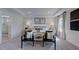 Serene primary bedroom with sitting area and ensuite bathroom at 668 Morning Glade St, Wake Forest, NC 27587