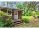 Cozy backyard with a well-maintained lawn and a brick patio, perfect for outdoor entertaining at 7 Woodward Way, Chapel Hill, NC 27516