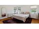 Well-lit bedroom with hardwood floors, a large bed, a walk-in closet and ample storage space at 7 Woodward Way, Chapel Hill, NC 27516