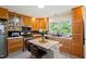 Bright kitchen with stainless steel appliances, custom cabinets, modern countertops and center island at 7 Woodward Way, Chapel Hill, NC 27516