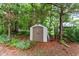 Storage shed in a shady spot on the property at 7 Woodward Way, Chapel Hill, NC 27516
