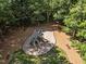 Aerial view of a community playground featuring slides, swings, and climbing structures at 7000 Millstone Ridge Ct, Raleigh, NC 27614