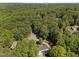 This aerial view showcases the property's location within a lush, wooded setting at 7000 Millstone Ridge Ct, Raleigh, NC 27614