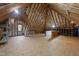 Spacious unfinished attic with wood beams and plywood floor at 7000 Millstone Ridge Ct, Raleigh, NC 27614