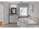 Bathroom with soaking tub and granite countertops at 7000 Millstone Ridge Ct, Raleigh, NC 27614