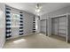 Bedroom with walk-in closet and multiple windows at 7000 Millstone Ridge Ct, Raleigh, NC 27614