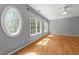Bedroom with large windows and a ceiling fan at 7000 Millstone Ridge Ct, Raleigh, NC 27614