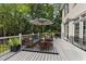 An outside patio contains outdoor furniture and a grill, making it the perfect spot for relaxing or entertaining at 7000 Millstone Ridge Ct, Raleigh, NC 27614