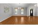 Open dining room with large windows looking to the front of the property at 7000 Millstone Ridge Ct, Raleigh, NC 27614