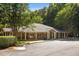 Charming clubhouse exterior with covered porch, columns, and well-maintained landscaping at 7000 Millstone Ridge Ct, Raleigh, NC 27614