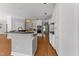Spacious kitchen with white cabinets, a large island, and stainless-steel appliances at 7000 Millstone Ridge Ct, Raleigh, NC 27614
