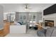 Beautiful living room with a cozy fireplace, and a comfortable sectional sofa with a table in the center at 7000 Millstone Ridge Ct, Raleigh, NC 27614