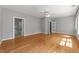 Main bedroom with a ceiling fan and an attached bathroom at 7000 Millstone Ridge Ct, Raleigh, NC 27614
