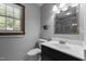 Updated bathroom with a large window, ample lighting, and modern fixtures at 825 Whispering Wind Rd, Burlington, NC 27217
