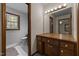 Well-lit bathroom with a vanity and mirror, complemented by a separate toilet area at 825 Whispering Wind Rd, Burlington, NC 27217