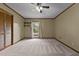 Bedroom featuring a ceiling fan, natural light, and ample closet space at 825 Whispering Wind Rd, Burlington, NC 27217
