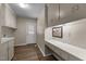 Laundry room with built in desk, extra counterspace, and overhead cabinets at 825 Whispering Wind Rd, Burlington, NC 27217