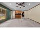 Spacious living area connected to a kitchen with barstool seating at 825 Whispering Wind Rd, Burlington, NC 27217