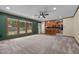Open living space flowing into kitchen with breakfast bar and plentiful natural light at 825 Whispering Wind Rd, Burlington, NC 27217