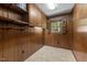 Walk-in pantry with wooden cabinets, shelving, and a window for natural light at 825 Whispering Wind Rd, Burlington, NC 27217