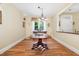 Formal dining room with hardwood floors and a large table, perfect for entertaining guests at 877 Millcroft, Pittsboro, NC 27312