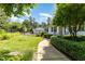 Beautifully landscaped yard with green grass, flowerbeds and manicured bushes at 877 Millcroft, Pittsboro, NC 27312