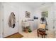 Efficient laundry room with a utility sink, washer, dryer, and exercise equipment at 877 Millcroft, Pittsboro, NC 27312