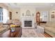Cozy living room featuring a fireplace, hardwood floors, and comfortable seating at 877 Millcroft, Pittsboro, NC 27312