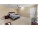 Comfortable bedroom featuring a ceiling fan, carpet flooring, and a comfortable bed setup at 1004 Bridgewater Dr, Durham, NC 27704