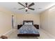 Bedroom featuring carpet flooring, a ceiling fan, and a comfortable bed setup at 1004 Bridgewater Dr, Durham, NC 27704