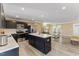 Modern kitchen features stainless steel appliances, a central island, and open layout to the living space at 1004 Bridgewater Dr, Durham, NC 27704