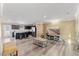 Open-concept living space featuring modern furniture, hardwood floors, and a stylish kitchen island at 1004 Bridgewater Dr, Durham, NC 27704