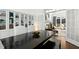 Elegant dining area with built-in shelving and a seamless flow to the living area at 103 Saint Brides Ct, Cary, NC 27518