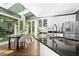 Well-lit kitchen features granite countertops, white cabinets, stainless steel appliances, and a cozy dining area at 103 Saint Brides Ct, Cary, NC 27518