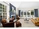 Bright and cozy living room with a fireplace and access to the outdoor deck at 103 Saint Brides Ct, Cary, NC 27518