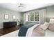 Inviting main bedroom with large windows, hardwood floors, and elegant decor at 103 Saint Brides Ct, Cary, NC 27518