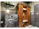 Well-organized mudroom with custom built-ins, patterned wallpaper, and a convenient washer at 103 Saint Brides Ct, Cary, NC 27518