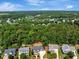 Aerial shot of home nestled in a lush neighborhood with many trees and scenic views at 10809 Grassy Creek Pl, Raleigh, NC 27614