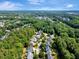 Aerial view showcases community surrounded by lush trees and beautiful landscaping at 10809 Grassy Creek Pl, Raleigh, NC 27614