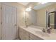 Bright bathroom features double sinks, a large mirror, and ample lighting at 10809 Grassy Creek Pl, Raleigh, NC 27614
