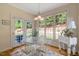 Charming breakfast nook with a table and chairs set by large windows offering natural light at 10809 Grassy Creek Pl, Raleigh, NC 27614