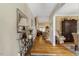 Inviting foyer with hardwood floors, decorative console table, and arched doorway at 10809 Grassy Creek Pl, Raleigh, NC 27614