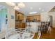 Bright kitchen features light wood cabinetry, stainless steel appliances, and an adjacent breakfast nook at 10809 Grassy Creek Pl, Raleigh, NC 27614