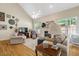 Cozy living room with hardwood floors, fireplace, and plenty of natural light at 10809 Grassy Creek Pl, Raleigh, NC 27614