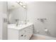 Bathroom vanity with a mirror, double sinks, and neutral walls at 1084 Wild Briar Ln, Stem, NC 27581