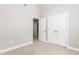 Bedroom with carpet, white trim, and closet at 1084 Wild Briar Ln, Stem, NC 27581