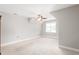 Bedroom featuring neutral walls, carpet, ceiling fan, and window at 1084 Wild Briar Ln, Stem, NC 27581