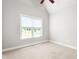 Bedroom featuring neutral walls, carpet, and window at 1084 Wild Briar Ln, Stem, NC 27581