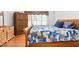 Inviting bedroom featuring hardwood floors, window, and furniture at 1084 Wild Briar Ln, Stem, NC 27581