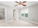 Bedroom with carpet, ceiling fan, and a window at 1084 Wild Briar Ln, Stem, NC 27581
